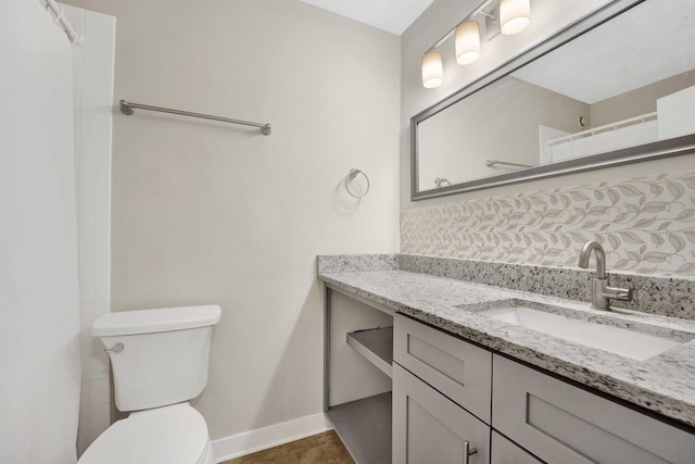 801 S Plymouth Ct Unit 711, Chicago, IL 60605 - bathroom featuring toilet, vanity, and baseboards