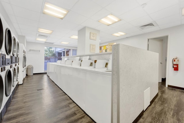801 S Plymouth Ct Unit 711, Chicago, IL 60605 - community laundry room featuring stacked washer and clothes dryer, washing machine and dryer, dark wood-style flooring, and baseboards