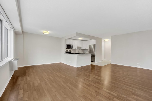801 S Plymouth Ct Unit 711, Chicago, IL 60605 - unfurnished living room with wood finished floors and baseboards