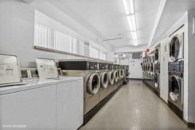 community laundry room with stacked washer and clothes dryer and washer and clothes dryer