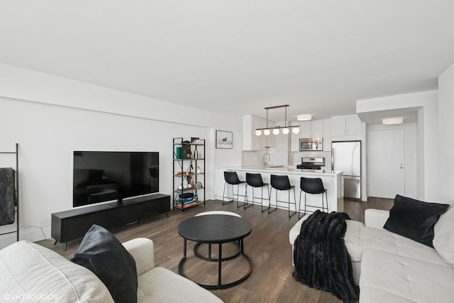 living area with dark wood-style flooring