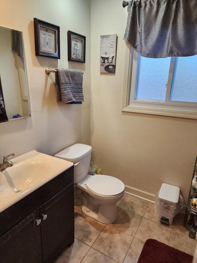 319 Serena Dr, Chicago Heights, IL 60411 - half bathroom with toilet, vanity, tile patterned floors, and baseboards