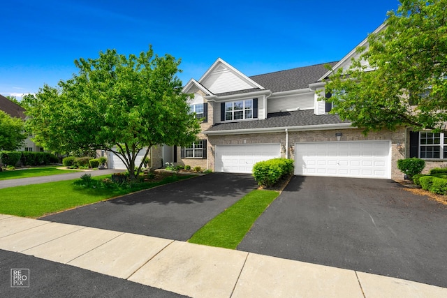 11911 Winterberry Ln, Plainfield, IL 60585 - multi unit property featuring asphalt driveway, an attached garage, and brick siding
