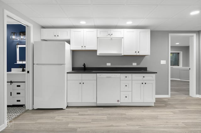 11911 Winterberry Ln, Plainfield, IL 60585 - kitchen with white appliances, a sink, recessed lighting, dark countertops, and white cabinets