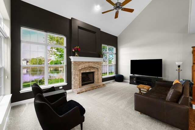 11911 Winterberry Ln, Plainfield, IL 60585 - living area with high vaulted ceiling, carpet floors, ceiling fan, a brick fireplace, and baseboards
