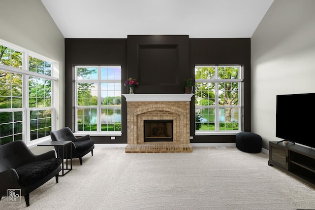 11911 Winterberry Ln, Plainfield, IL 60585 - living area with vaulted ceiling, a fireplace, and carpet floors