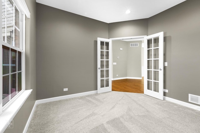 11911 Winterberry Ln, Plainfield, IL 60585 - carpeted spare room featuring french doors and baseboards