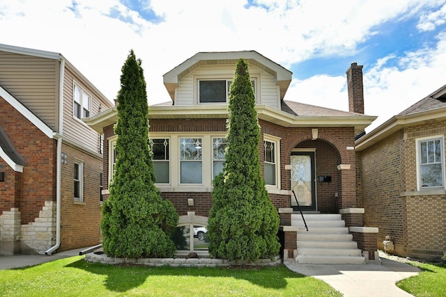6211 W School St, Chicago, IL 60634 - view of front of property with brick siding and a front lawn