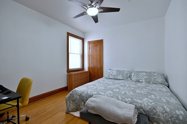 6211 W School St, Chicago, IL 60634 - bedroom with wood finished floors, baseboards, and a ceiling fan