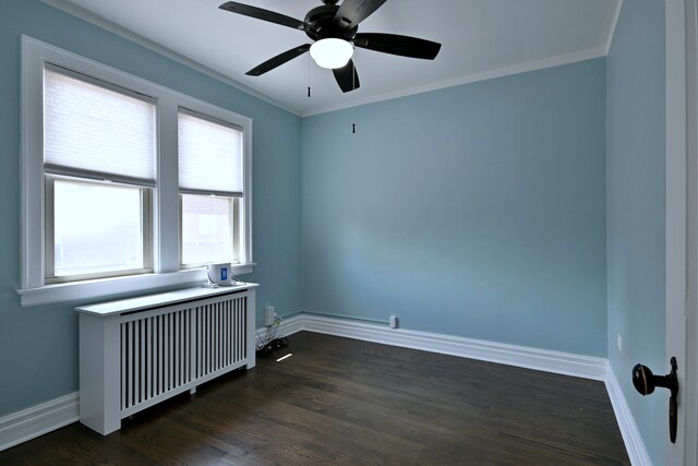 6211 W School St, Chicago, IL 60634 - empty room featuring radiator heating unit, dark wood-type flooring, ceiling fan, baseboards, and crown molding
