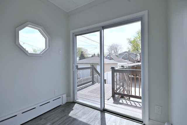 6211 W School St, Chicago, IL 60634 - doorway featuring a baseboard radiator, plenty of natural light, and dark wood-style flooring