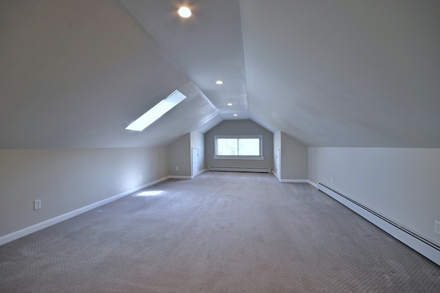6211 W School St, Chicago, IL 60634 - additional living space with baseboard heating, lofted ceiling, a baseboard heating unit, baseboards, and carpet floors