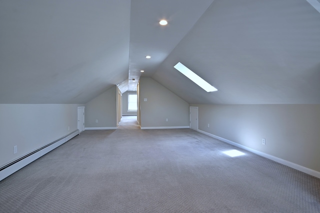 6211 W School St, Chicago, IL 60634 - bonus room with a baseboard radiator, a skylight, lofted ceiling, baseboards, and recessed lighting