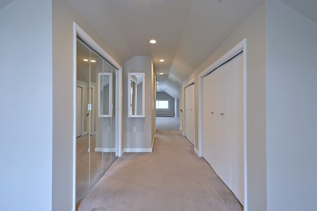 6211 W School St, Chicago, IL 60634 - hall featuring vaulted ceiling, light carpet, a baseboard heating unit, recessed lighting, and baseboards