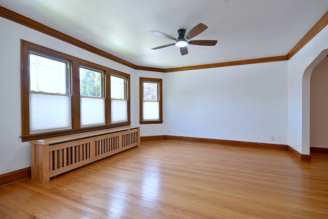6211 W School St, Chicago, IL 60634 - unfurnished room with radiator, arched walkways, ceiling fan, light wood-type flooring, and ornamental molding