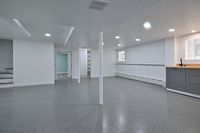 6211 W School St, Chicago, IL 60634 - basement with baseboard heating, recessed lighting, baseboards, stairs, and healthy amount of natural light