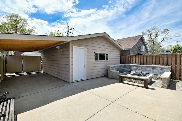 6211 W School St, Chicago, IL 60634 - view of outbuilding featuring an outdoor fire pit and fence