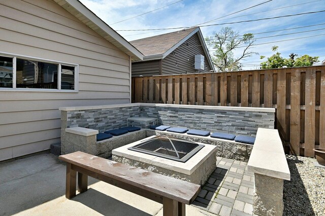 6211 W School St, Chicago, IL 60634 - view of patio featuring an outdoor fire pit and fence