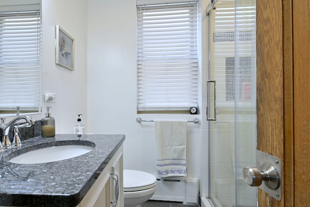 6211 W School St, Chicago, IL 60634 - full bathroom featuring a shower stall, vanity, and toilet