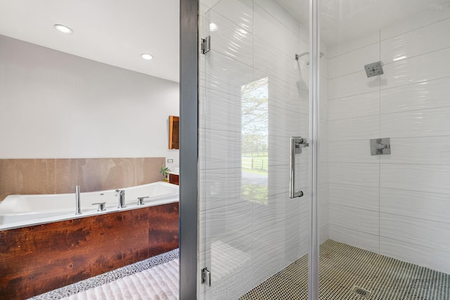 8311 Haligus Rd, Huntley, IL 60142 - bathroom with a garden tub, a shower stall, and recessed lighting
