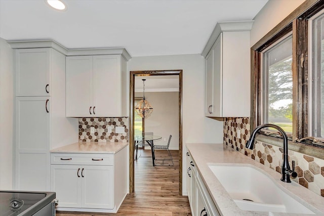 2958 N 1100 E Rd, Clifton, IL 60927 - kitchen featuring a sink, tasteful backsplash, light wood-style floors, stainless steel range with electric stovetop, and light stone countertops