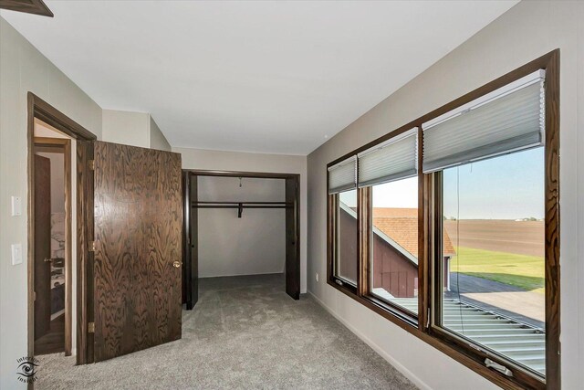 2958 N 1100 E Rd, Clifton, IL 60927 - unfurnished bedroom with light colored carpet, a closet, and baseboards