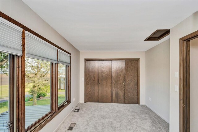 2958 N 1100 E Rd, Clifton, IL 60927 - unfurnished bedroom with carpet flooring, a closet, access to outside, and baseboards