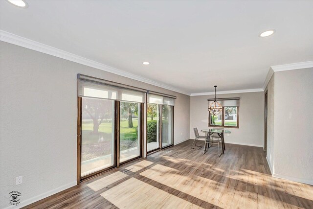 2958 N 1100 E Rd, Clifton, IL 60927 - unfurnished dining area featuring wood finished floors, a chandelier, baseboards, recessed lighting, and crown molding