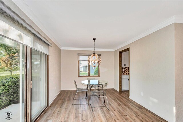 2958 N 1100 E Rd, Clifton, IL 60927 - dining space with light wood-type flooring, crown molding, a chandelier, and baseboards