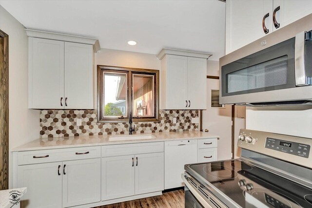 2958 N 1100 E Rd, Clifton, IL 60927 - kitchen with appliances with stainless steel finishes, a sink, light countertops, backsplash, and recessed lighting