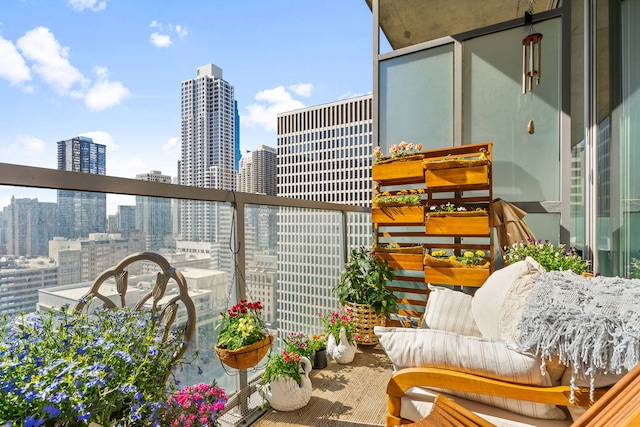 balcony featuring a skyline view