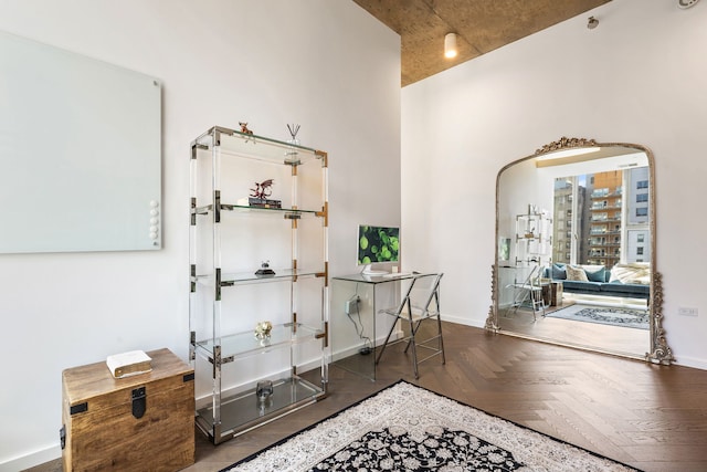 hall featuring baseboards