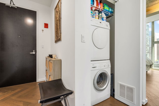 laundry area featuring estacked washer and dryer