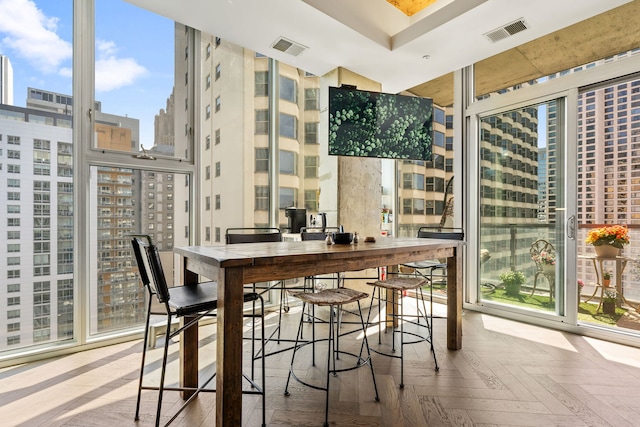 bar with a city view and a high ceiling