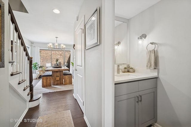 921 Harlem Ave Unit 1, Glenview, IL 60025 - bathroom featuring a chandelier, wood finished floors, vanity, and recessed lighting
