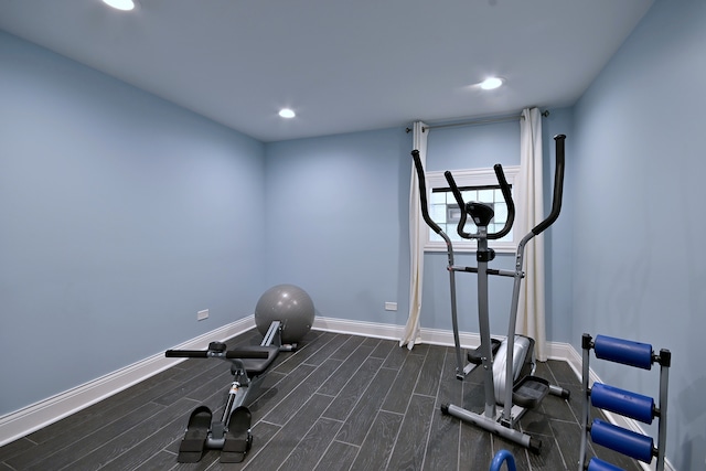 workout area featuring baseboards and recessed lighting