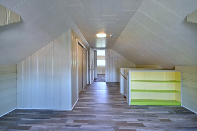 bonus room featuring wood finished floors and lofted ceiling