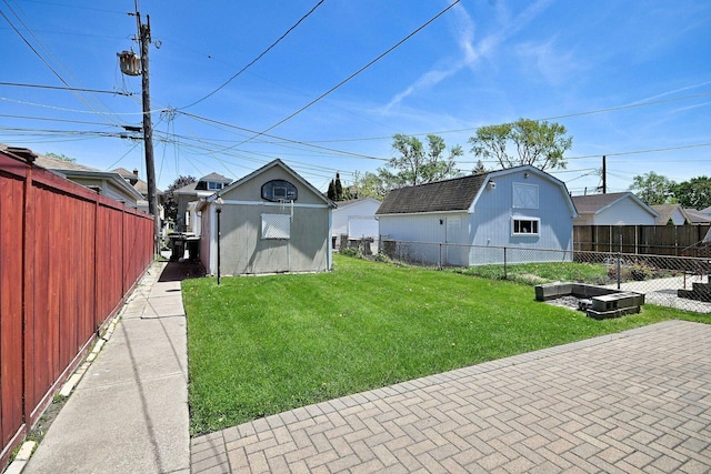 view of yard with an outbuilding and a storage shed