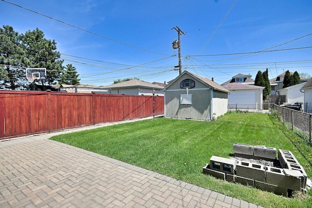 view of yard featuring a shed and an outdoor structure