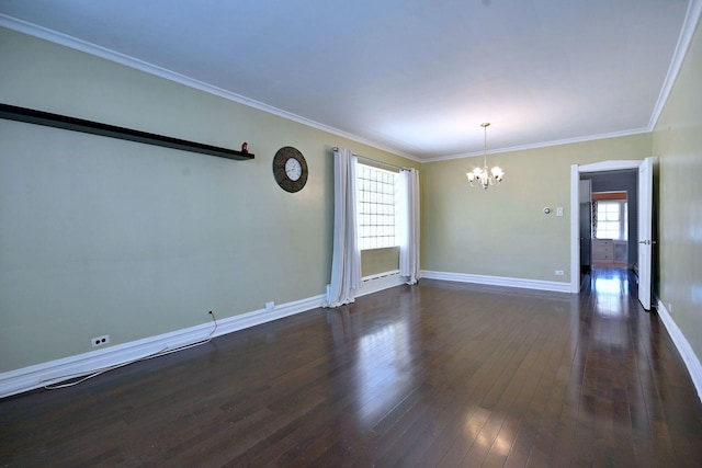 unfurnished room featuring a chandelier, healthy amount of natural light, baseboards, dark wood-type flooring, and crown molding