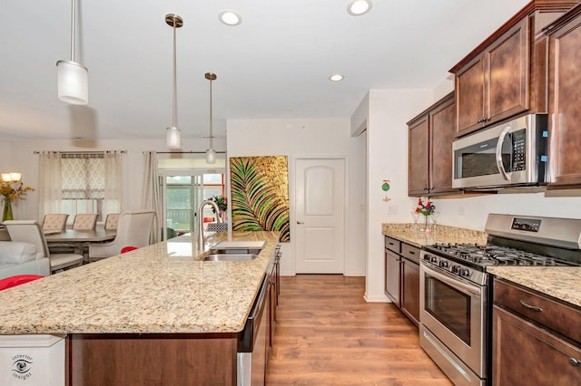 6359 Doral Dr, Gurnee, IL 60031 - kitchen with stainless steel appliances, a sink, dark wood-style flooring, light stone countertops, and recessed lighting