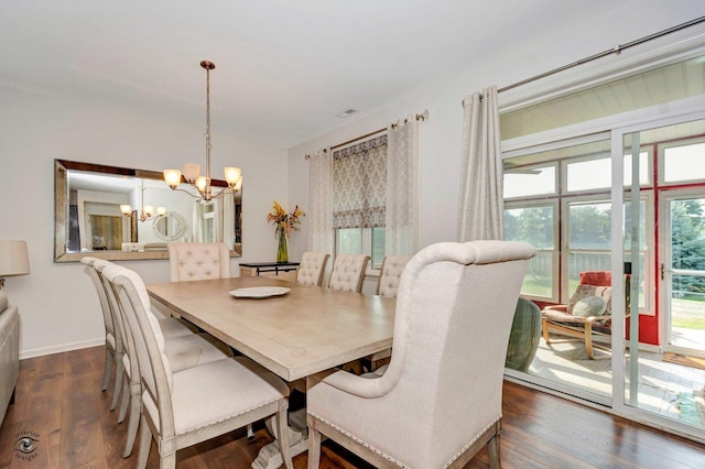 6359 Doral Dr, Gurnee, IL 60031 - dining space with a chandelier, dark wood-type flooring, and baseboards