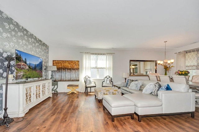 6359 Doral Dr, Gurnee, IL 60031 - living area featuring wallpapered walls, an accent wall, a chandelier, and wood finished floors