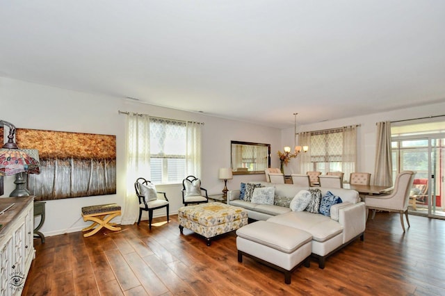 6359 Doral Dr, Gurnee, IL 60031 - living room featuring a chandelier, dark wood-style floors, and baseboards