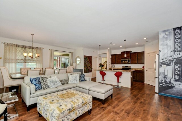 6359 Doral Dr, Gurnee, IL 60031 - living room with a chandelier, dark wood-type flooring, and recessed lighting