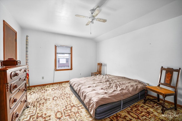 bedroom with baseboards and a ceiling fan