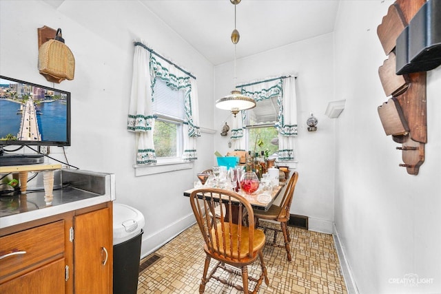 dining space featuring baseboards