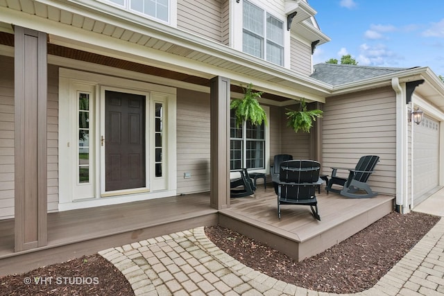 384 Edgewater Ct, Sugar Grove, IL 60554 - wooden deck featuring an attached garage and concrete driveway