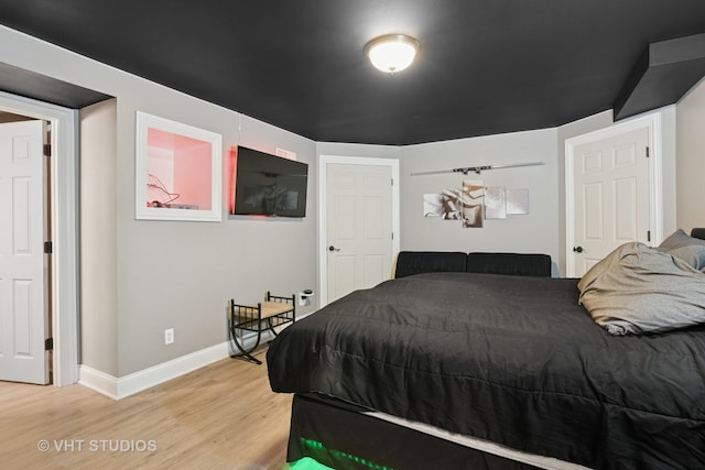 384 Edgewater Ct, Sugar Grove, IL 60554 - bedroom with light wood-type flooring and baseboards
