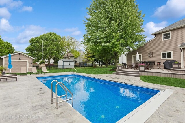 384 Edgewater Ct, Sugar Grove, IL 60554 - outdoor pool with a wooden deck and a patio